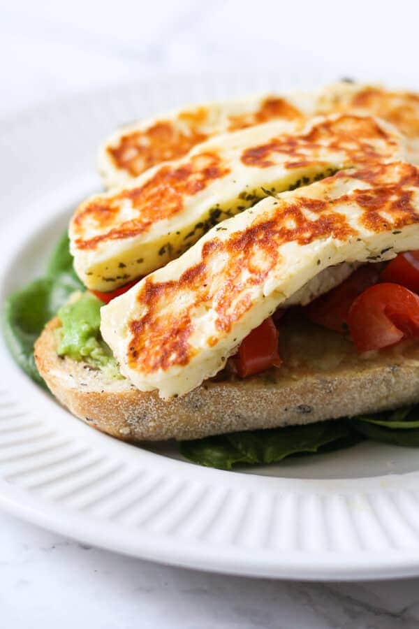 grilled halloumi on top of avocado toast.