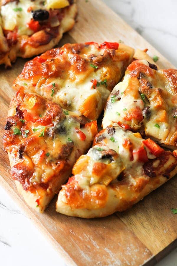 Roast Pumpkin Pizza on a wooden serving board.