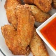 chicken wings on a white plate.