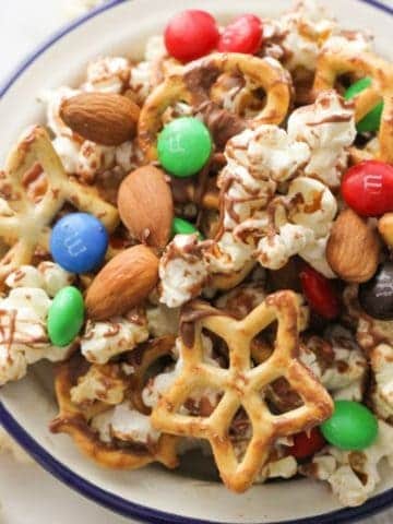 popcorn trail mix in a white serving bowl.