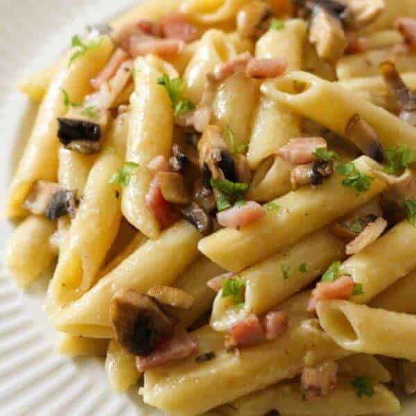 Creamy Carbonara on a white plate.