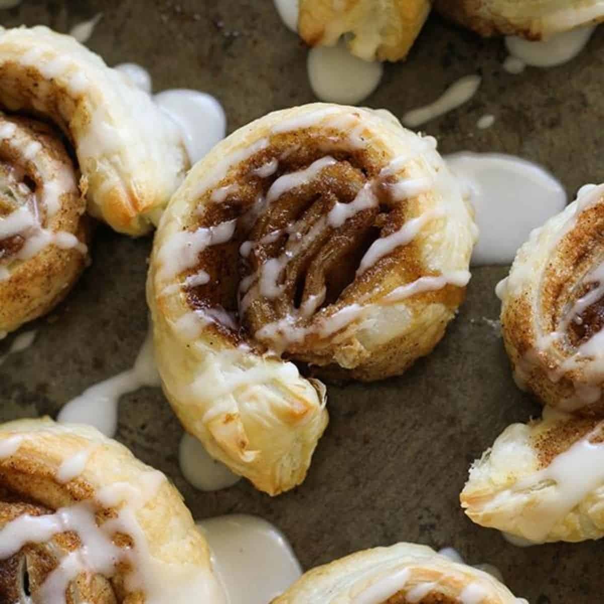 cinnamon rolls on a baking tray.