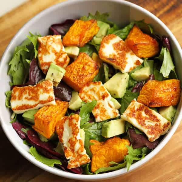pumpkin, haloumi and avocado salad in a bowl