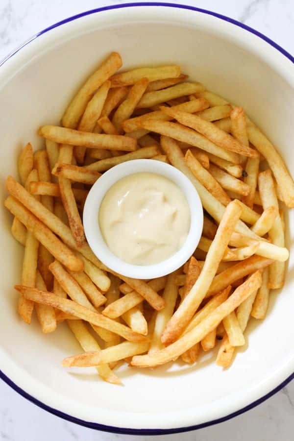 french fries in a white bowl.