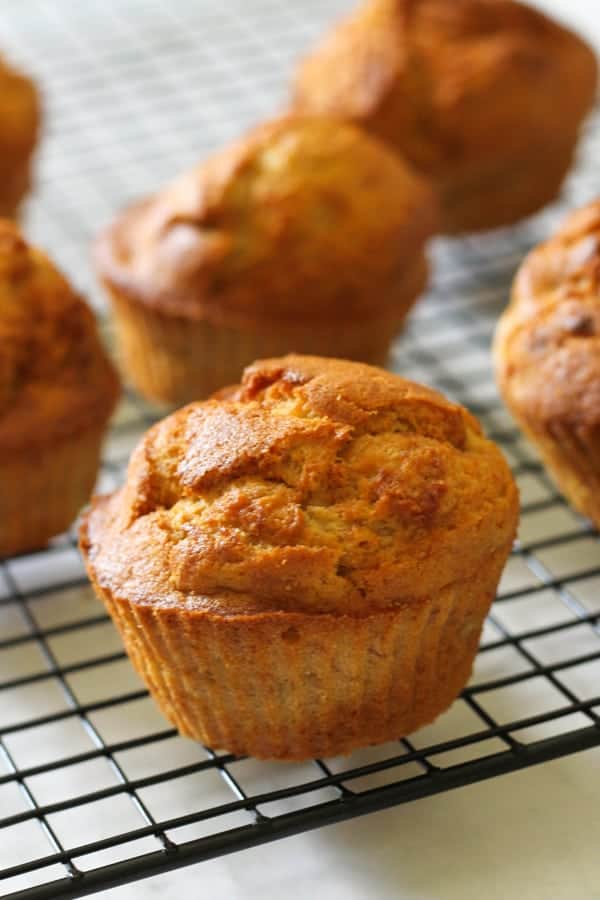 air fryer banana muffins on a wire cooling rack.