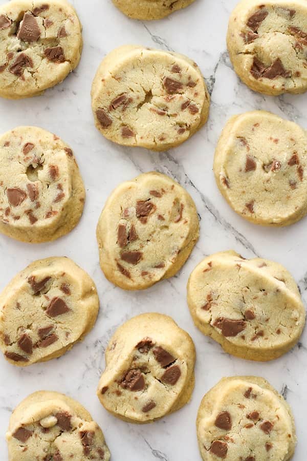 chocolate chip shortbread cookies on a marble background.