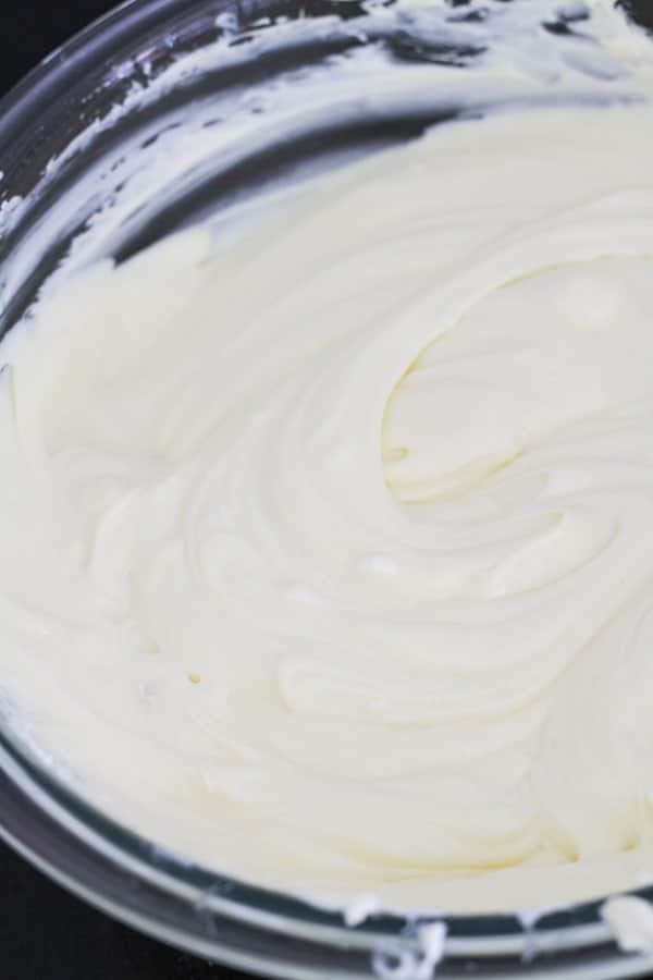 cheesecake mixture in a glass bowl.