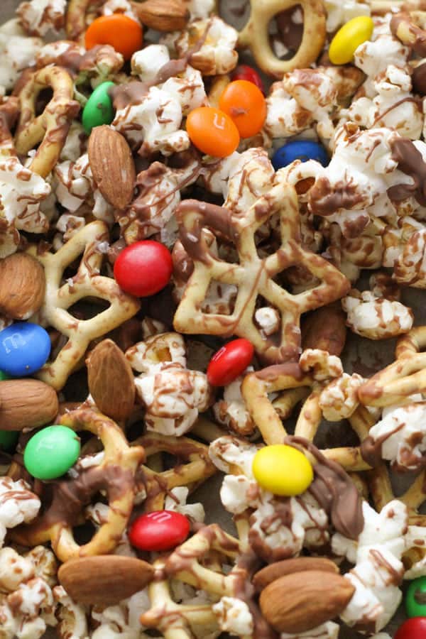 popcorn snack mix on a baking tray.