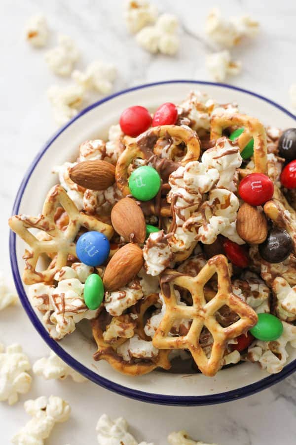 popcorn snack mix in a white bowl.