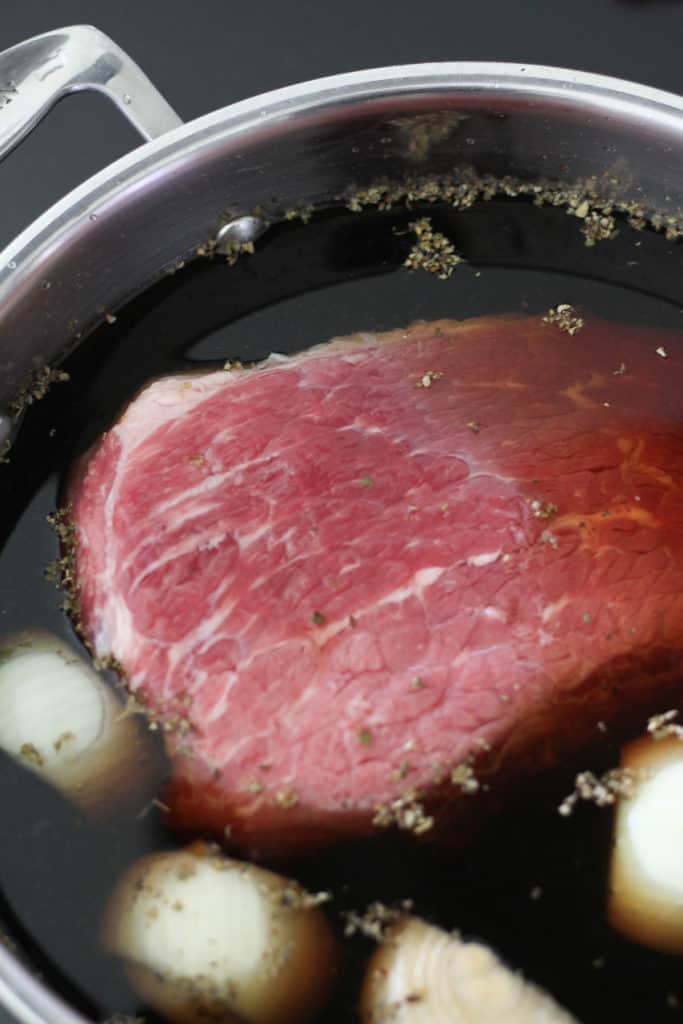 the meat in a saucepan filled with water