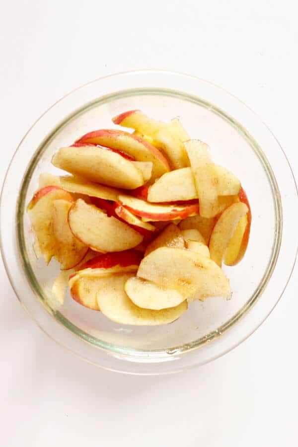 sliced apples in a glass bowl