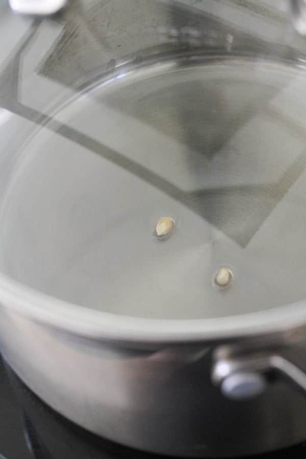 unpopped kernels in a saucepan.