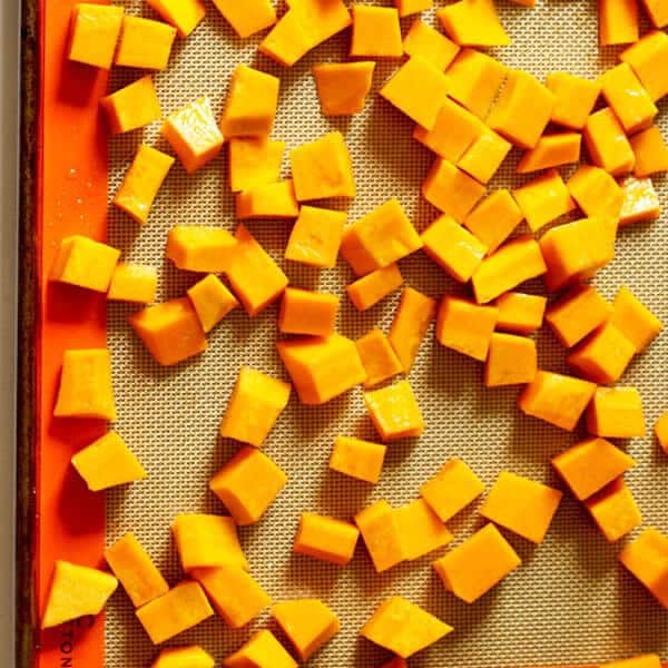 diced pumpkin on a baking tray