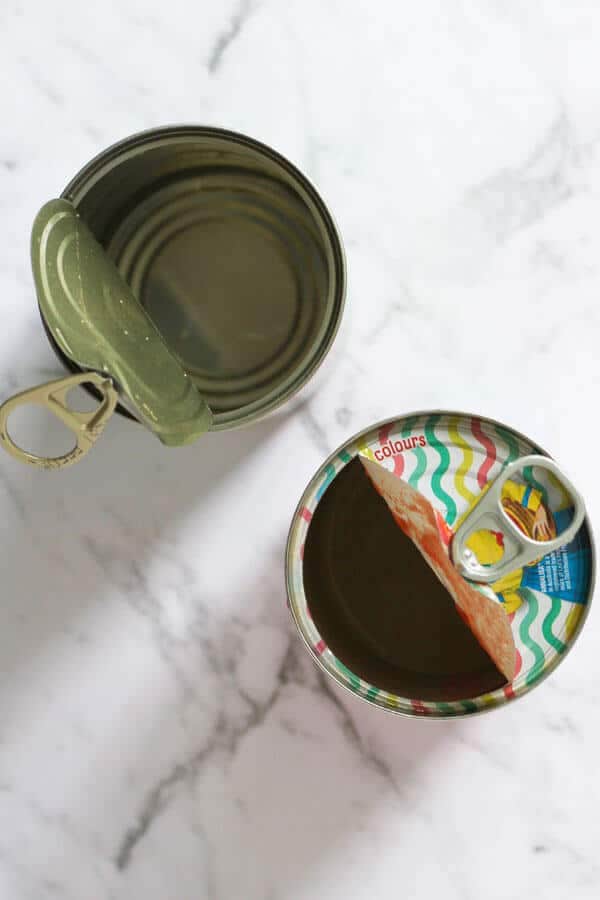 two empty cans of tomatoes