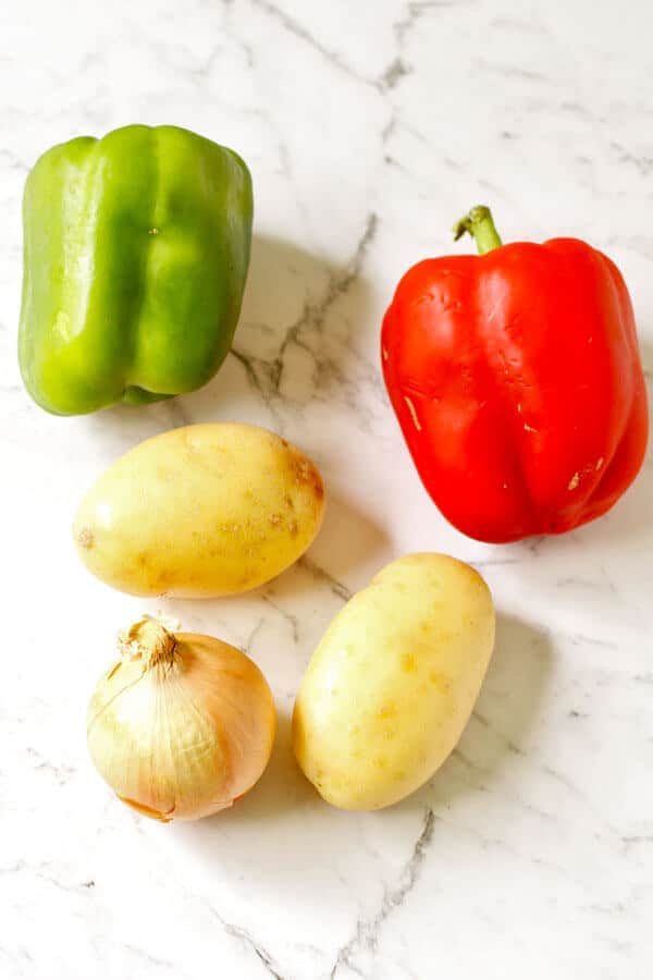 crispy breakfast potato ingredients arranged as a flat lay