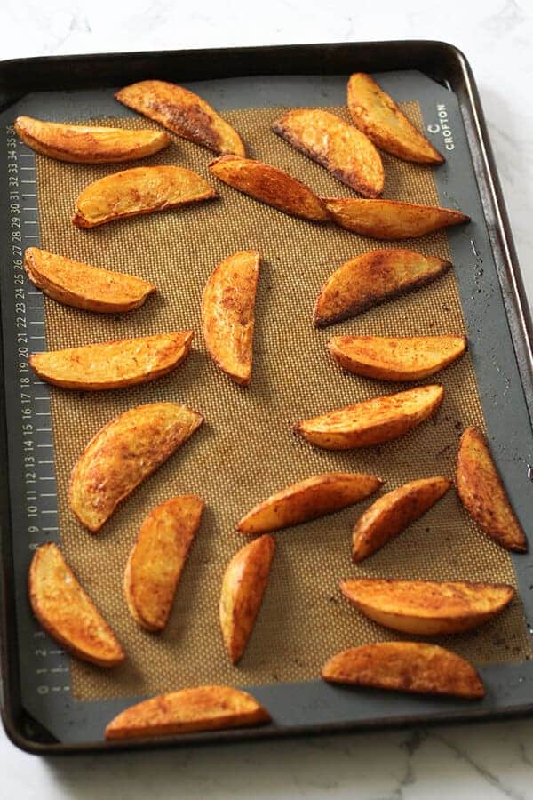 potato wedges on a baking tray.