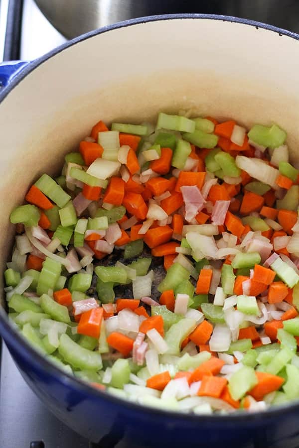 Italian Minestrone Soup ingredients in a dutch oven.
