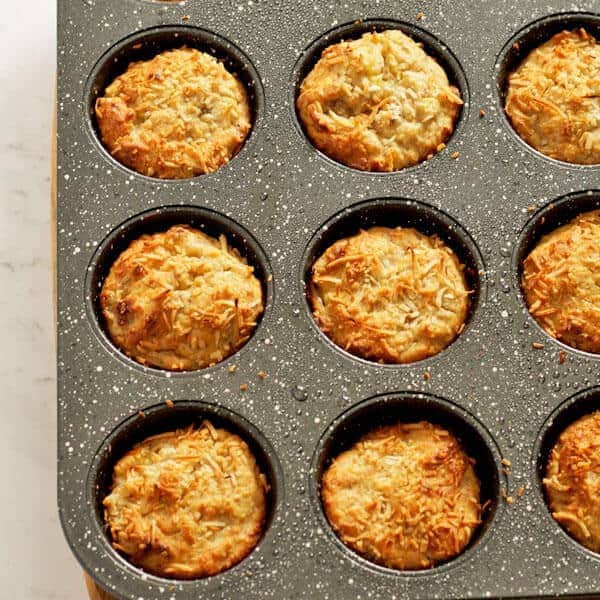 banana coconut muffins sitting in muffin tray
