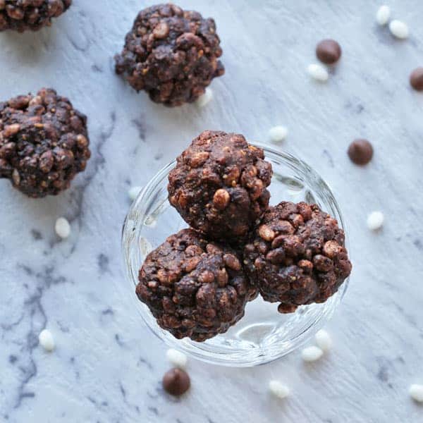 a bunch of healthy chocolate crackles in a glass cup