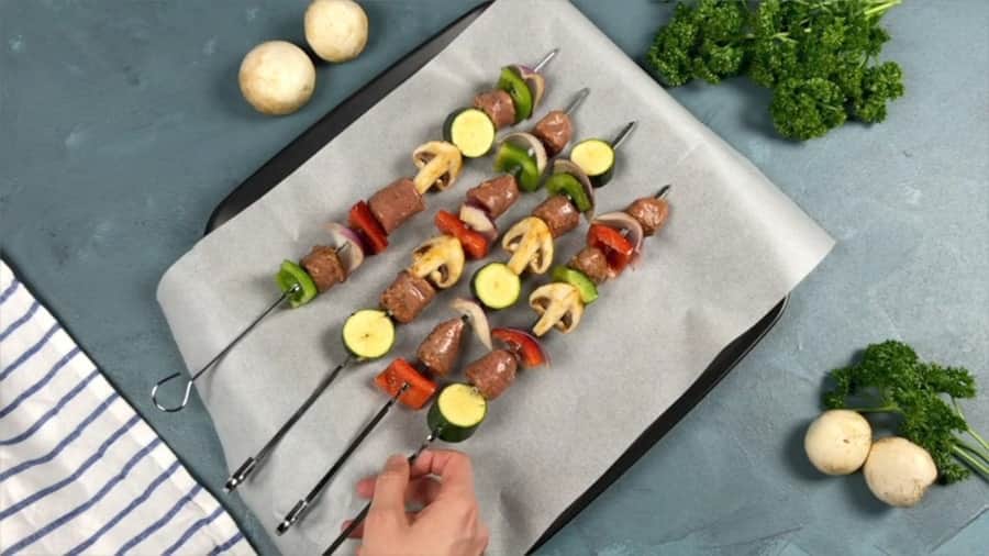sausage and veggie skewers ready to be grilled.