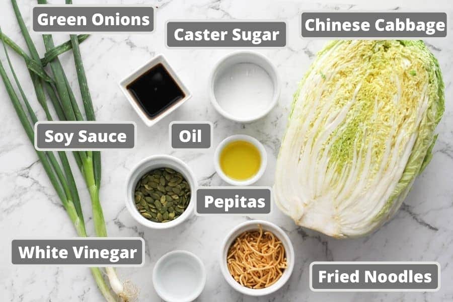 cabbage salad ingredients including soy sauce, olive oil and fried noodles.