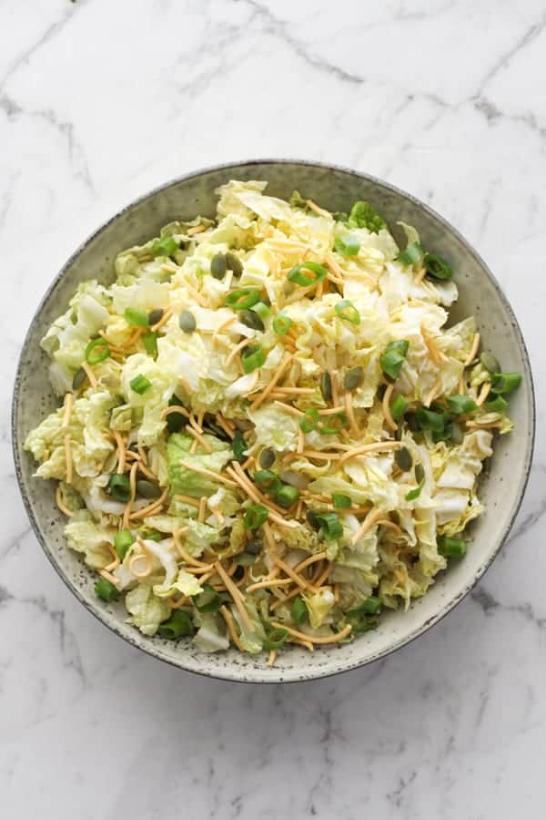 cabbage and crunchy noodle salad in a large bowl.