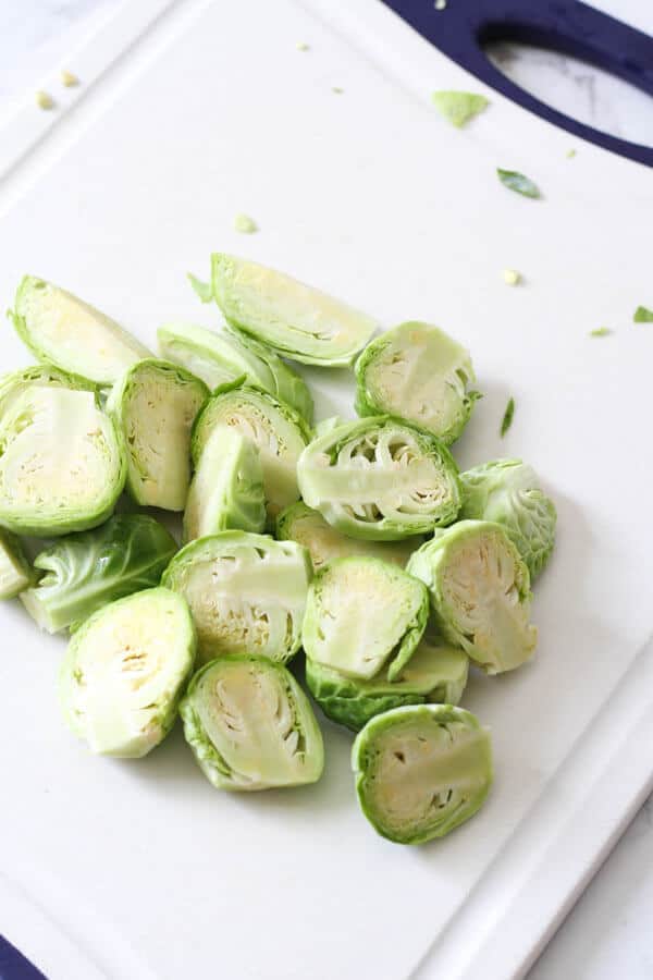 halved brussels sprouts on a cutting board