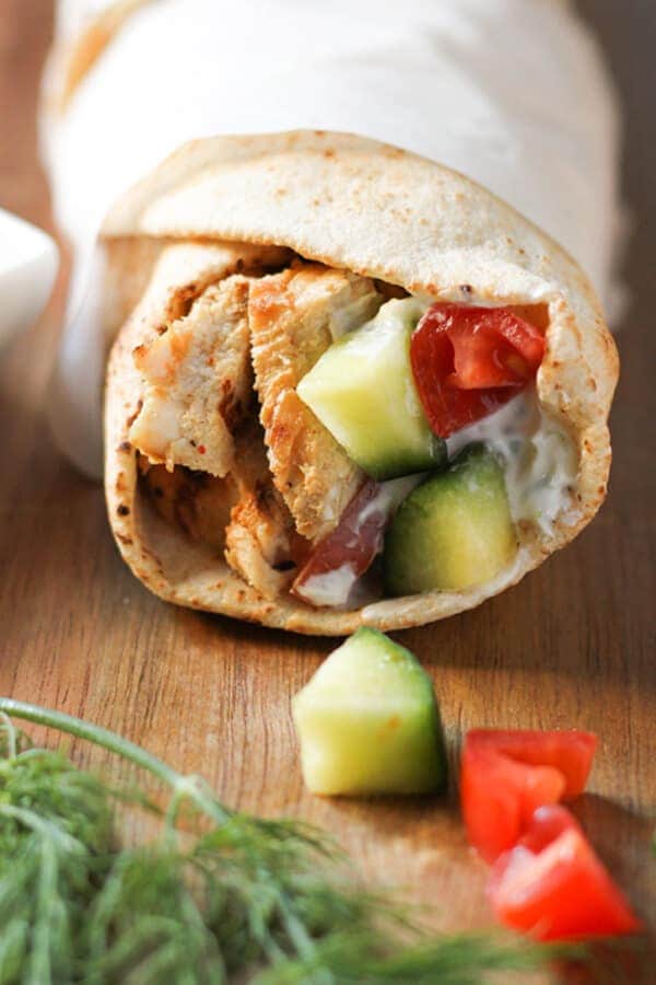 chicken gyro wrapped in parchment paper.
