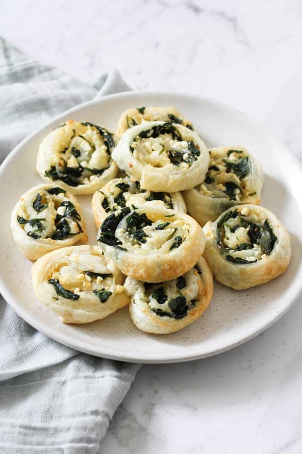 spinach & feta pinwheels on a white plate