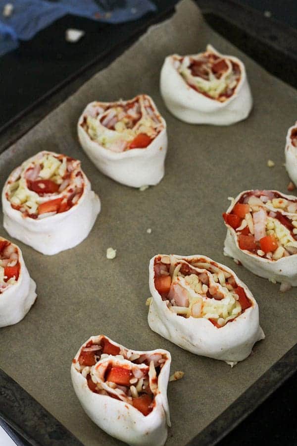 pizza pinwheels ready for the oven.