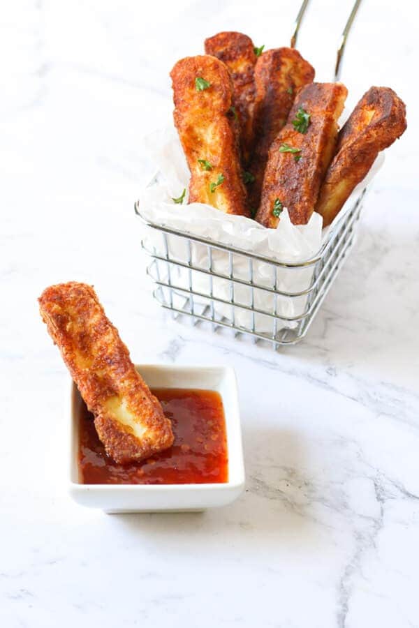 halloumi fries in a wire basket.