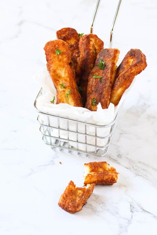 halloumi fries in a wire basket.