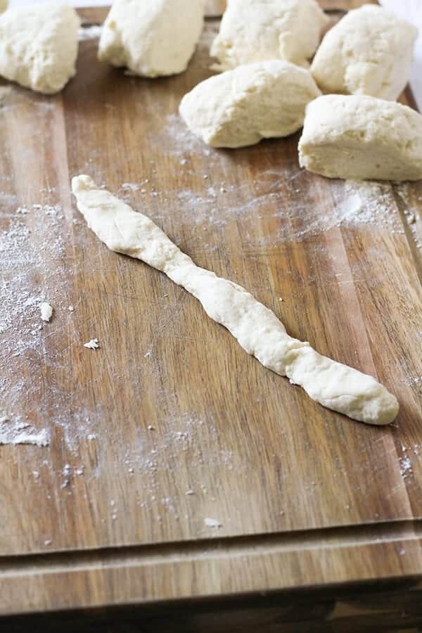 a piece of dough rolled out into a rope shape.