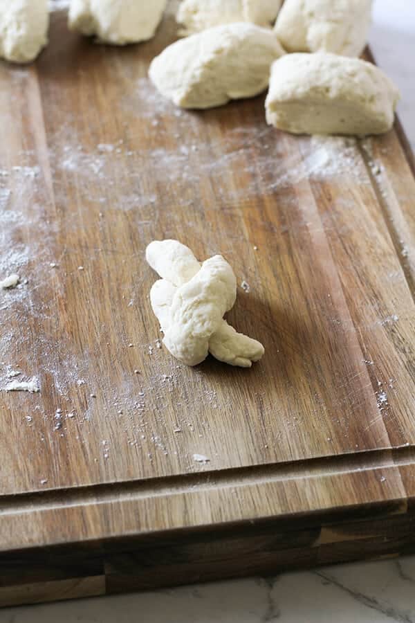 a piece of dough tied into a knot shape.