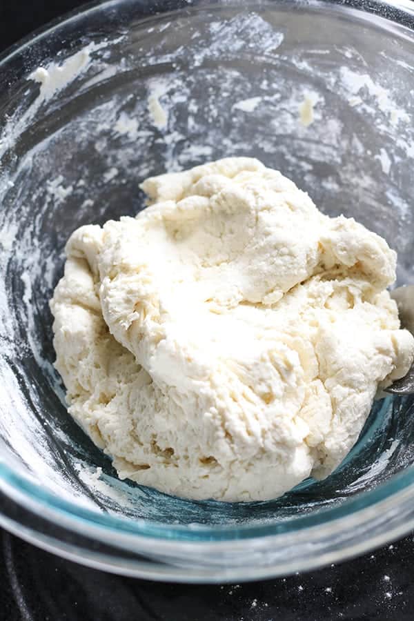 dough in a glass bowl.