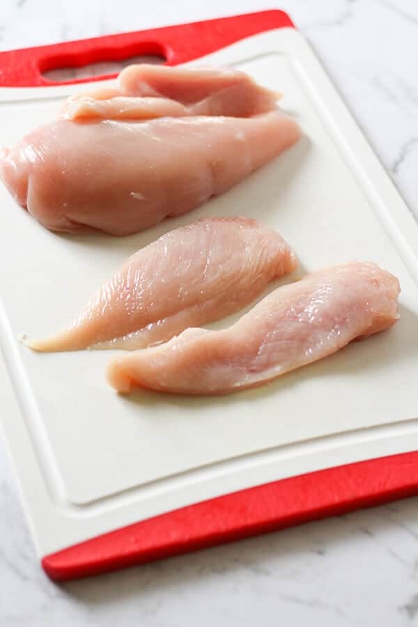 Chicken breast sliced in half.