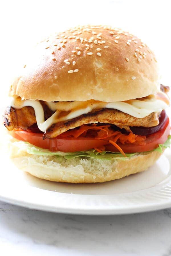 Grilled Chicken Burger on a wooden board.