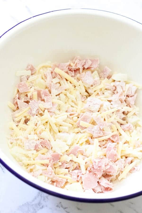 impossible quiche ingredients in a mixing bowl.