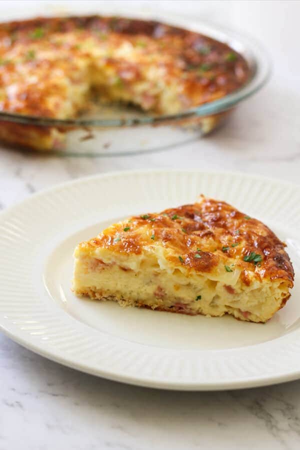 a slice of Impossible Quiche on a white plate.