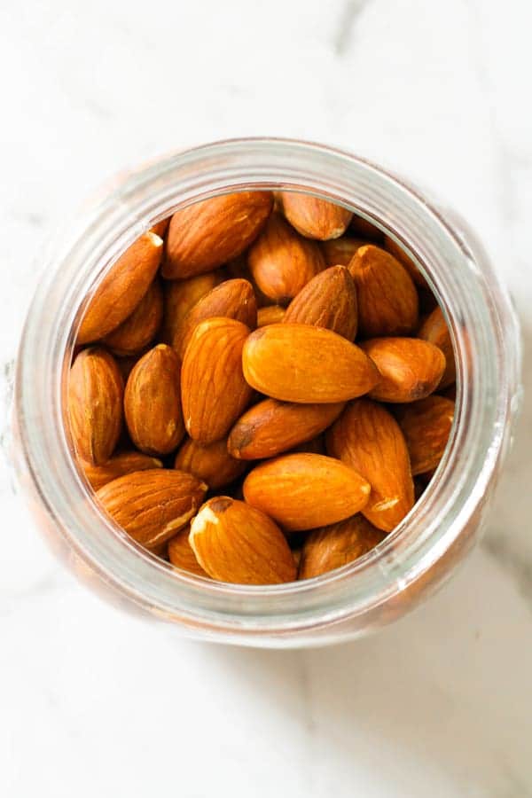 roasted almonds in a glass jar.