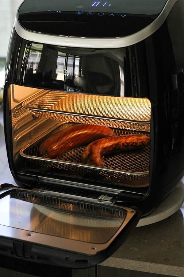 bananas roasting in an air fryer. 