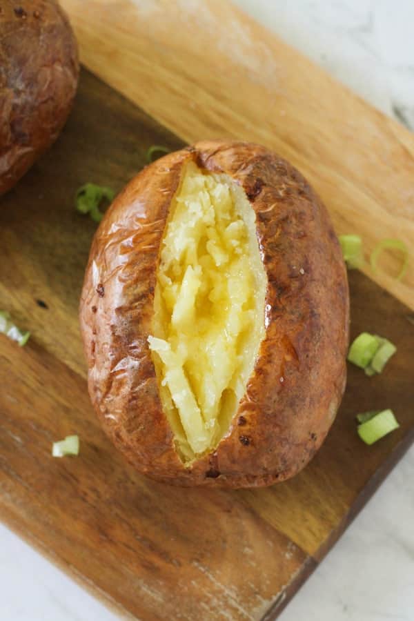 baked potato topped with butter.