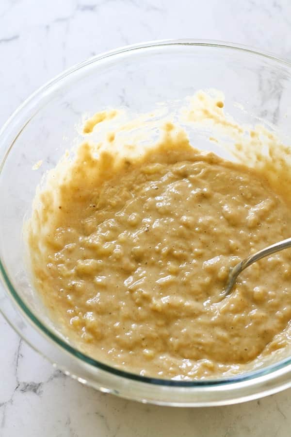 banana loaves mixture in a glass mixing bowl. 