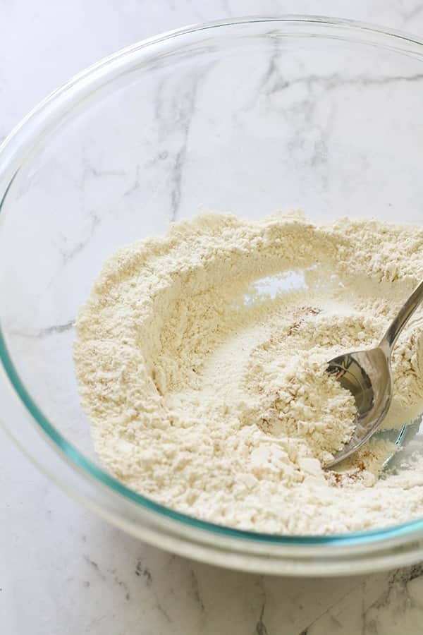 flour in a glass mixing bowl.