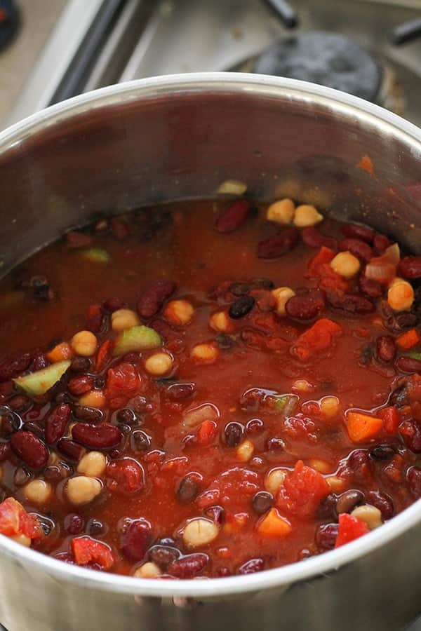 all vegetarian three bean chili ingredients in a large pot.