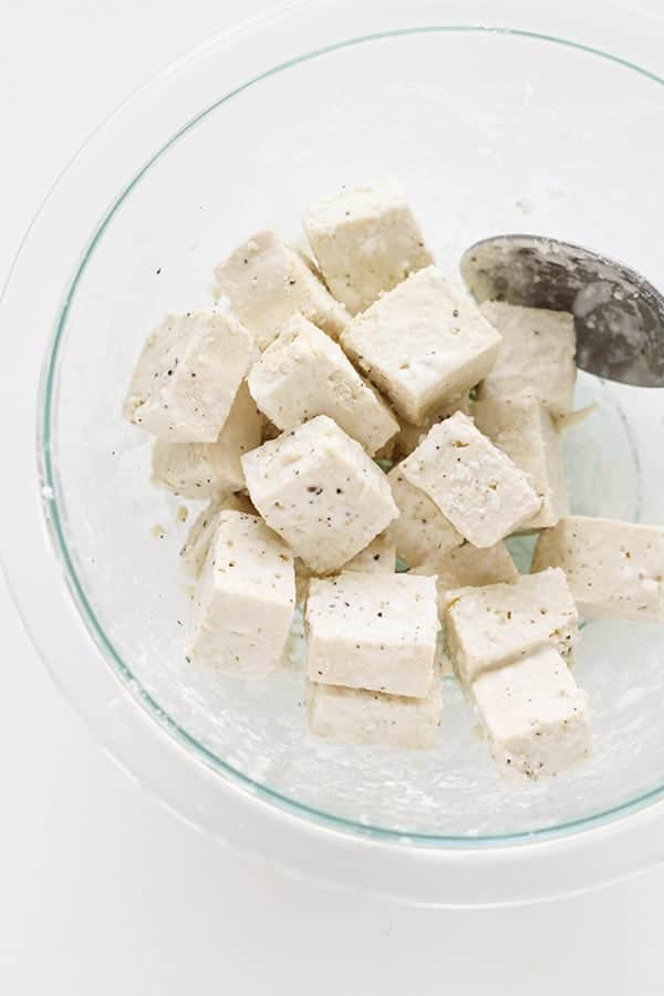tofu cubes in a glass bowl.