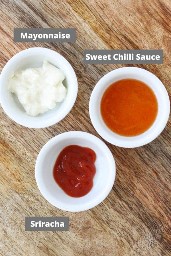 ingredients for sauce on a wooden board.