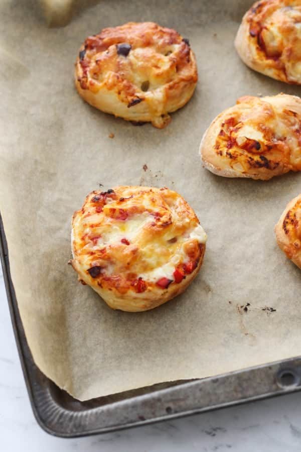 vegetarian pizza rolls on a baking tray.
