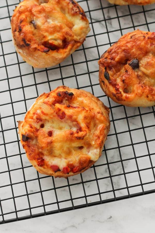 vegetarian pizza rolls on a wire cooling rack.