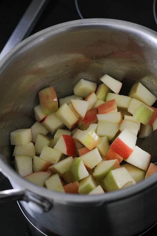 apple pieces in a saucepan.